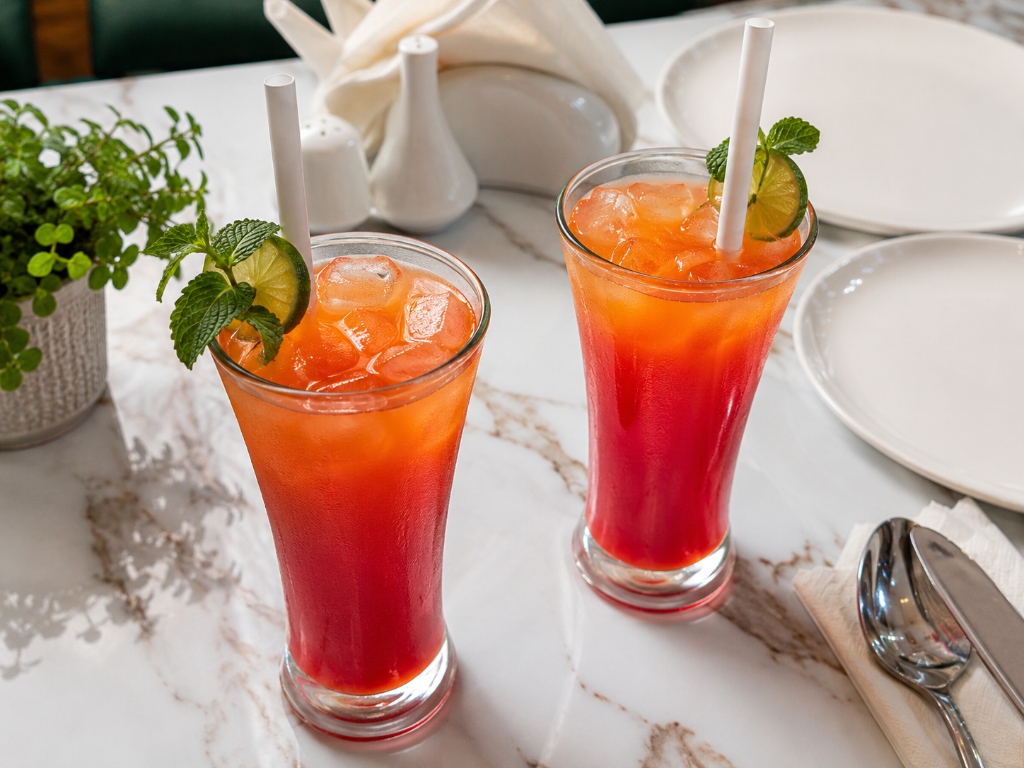 Hand-shaken sunset mocktails drinks with lime and mint at Kahani Cafe